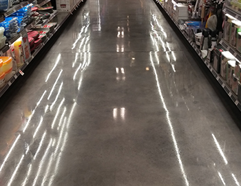 A glossy concrete warehouse aisle
